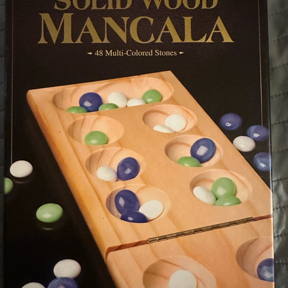 Brown and Green Wooden Mancala Board Game
